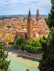 Fototapeta premium Facade of Basilica di Santa Anastasia in Verona, Italy, with Gothic architecture and brick exterior under a bright sunny sky