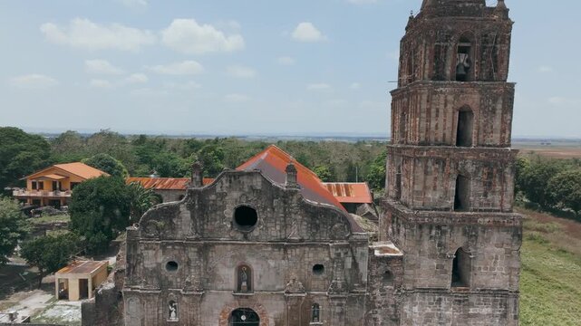 4K Aerial Of  Isabela's Oldest: San Pablo de Cabagan Church In Philippines.
Blend of adobe, bricks, riverstones, and coral stones in its construction.