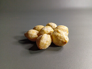 Pile of Raw Candlenuts: Essential Spice for Indonesian Dishes