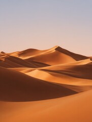 Serene golden sand dunes under a clear sky, showcasing natural beauty and tranquility