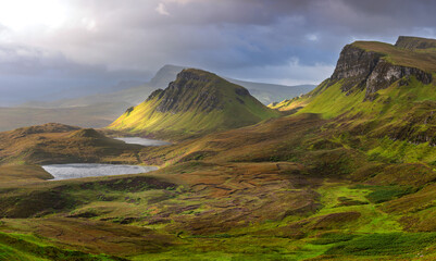 Panoramic view of the Trotternish Ridge on a dramatic summer morning seen from The Quiraing on The Isle of Skye, Scotland, UK.