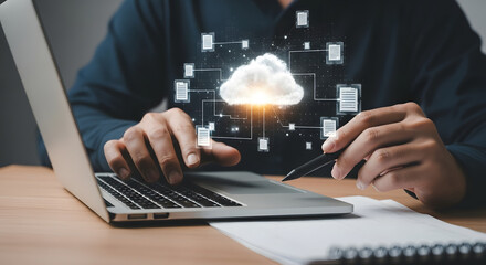 Person working on a laptop with a cloud computing graphic overlay.