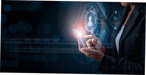 A woman uses her smartphone to interact with a futuristic digital interface, symbolizing advanced technology and connectivity