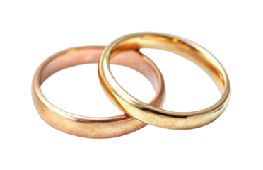 Two interlocking gold and copper wedding rings symbolizing love and unity
