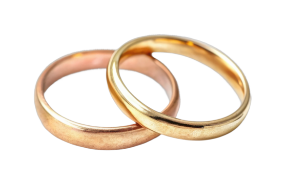 Two interlocking gold and copper wedding rings symbolizing love and unity