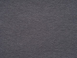 The textured charcoal gray felt.