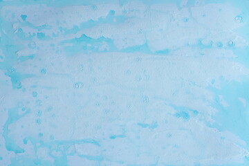 Abstract pattern drawn with blue paint on white paper background. Graphic resource.