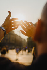 hands of a man and woman At sunset