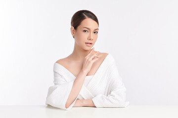 A beautiful young Asian woman with clean, fresh skin against a white background. Skincare, facial...