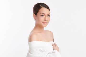 A beautiful young Asian woman with clean, fresh skin against a white background. Skincare, facial...