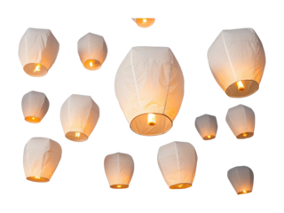 Floating lanterns illuminated in the night sky