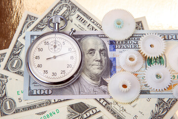mechanical stopwatch on the background of dollars. Part time accuracy for business. business and...