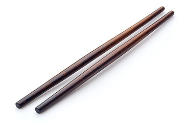 A pair of dark brown wooden chopsticks lying parallel on a white surface, casting a soft shadow.