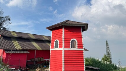 Red octagonal tower and red building in Bukit Fraser for travel brochures, architectural websites,...