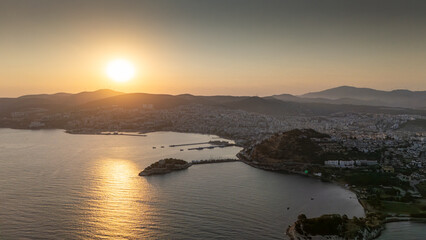 Fototapeta premium Aerial view of Guvercinada Island (Pigeon Island) with scenic castle at Kusadasi, Turkey. The large resort town is a popular tourist destination in Turkey.