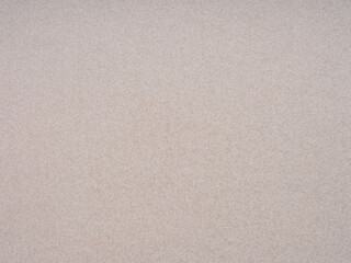 A close-up view reveals the intricate details and subtle elegance of a beige paper canvas