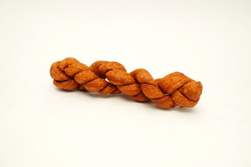 Kue untir untir or kue tambang isolated on white background, untir-untir is a traditional Indonesian deep fried twisted doughnut that has a sweet and crunchy taste, snack, cookies, crispy, delicious