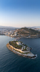 Obraz premium Aerial view of Guvercinada Island (Pigeon Island) with scenic castle at Kusadasi, Turkey. The large resort town is a popular tourist destination in Turkey.
