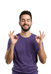 Young caucasian man with short dark hair and beard, wearing a purple t-shirt, stands peacefully with eyes closed, performing an "OK" hand gesture in a clean white studio background. Concept of