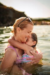 Joyful moments of family bonding at the beach during golden hour