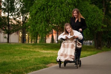 Girl with broken leg in wheelchair enjoys calm reading outdoors,reading brings focus and peace...