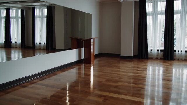 The Empty Dance Studio's Elevated Platform and Reflective Surface