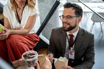 Business people enjoying lunch break together in office