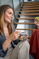 Businesswoman eating healthy snack at work during break time
