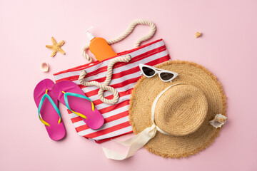 Summer travel beach essentials including a striped tote, hat, flip flops, and sunscreen