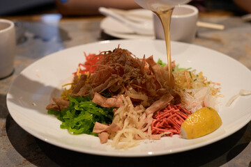 The image shows a close-up of a plated cold dish, likely a Chinese-style vegetables. It appears to contain shredded vegetables