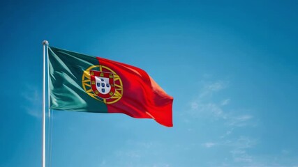 A beautiful flag of Portugal waves proudly against a clear blue sky, symbolizing freedom and national pride on Independence Day.