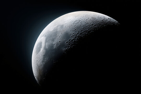 Close-up of the moon showcasing its craters and surface details against a dark sky