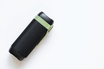 Music portable Bluetooth speaker black with green strap on white background, music
