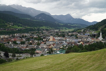 Panoramic view of the town of Schladming on the Dachstein massif under a cloudy sky. View of the...