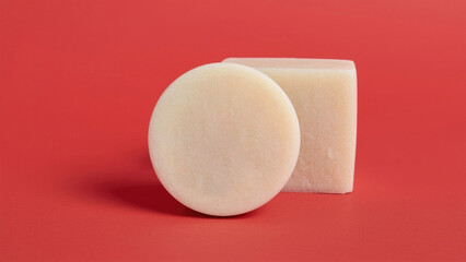 Circular and square shaped eco friendly solid shampoo bars displayed for sustainable and plastic-free hygiene product visuals.