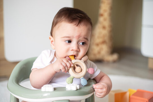 Baby chewing on teething ring