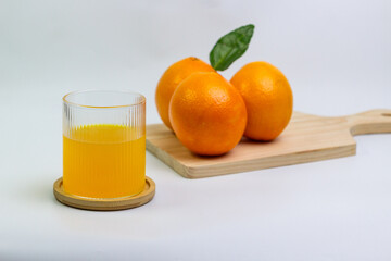 Fresh Orange Juice with Whole Oranges on Board