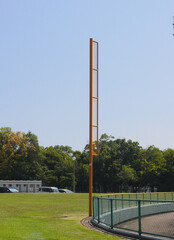 The foul pole in the baseball stadium inside the sports park.