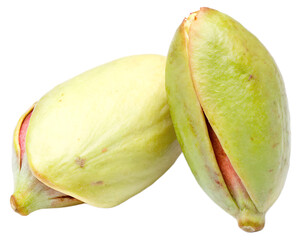 Close up shot of two unripe pistachios with a light green outer shell on a plain black background