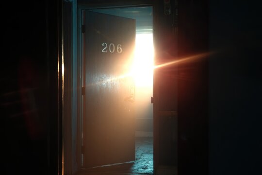 Open door, sunlight, mystery room
