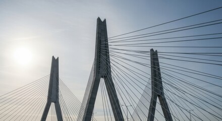 Impressive Modern Cable-Stayed Bridge with Three Towers Against a Bright Sky