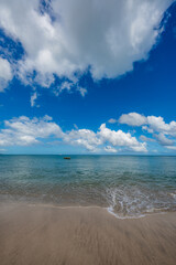 Tranquil Ocean View with Blue Sky and Clouds