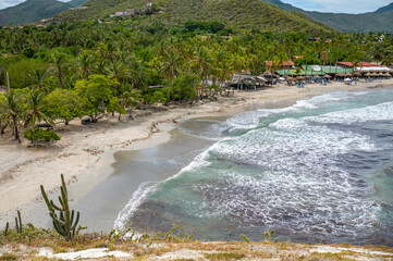  Aerial View of Coastal Village and Sandy Beach