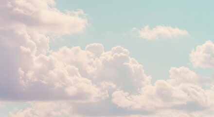 Fototapeta premium Fluffy Clouds Floating in Light Blue Sky Background