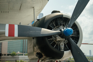 Detailed view of a vintage military aircraft's propeller engine with exposed mechanical components....