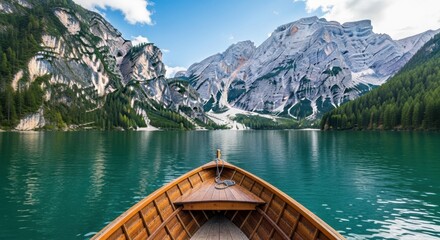 Obraz premium Serene Boat Ride Through Majestic Mountain Lake Landscape