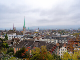 Panoramic view of Zurich, Switzerland, with historic rooftops, church spires, and autumn...