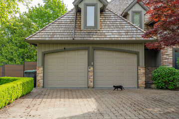 arage door in luxury house with nice landscape in Spring in Vancouver, Canada, North America. Day...