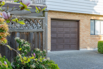 arage door in luxury house with nice landscape in Spring in Vancouver, Canada, North America. Day time on May 2025.