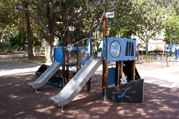 Unique playground equipment designed as a creative space shuttle with slides and interactive...